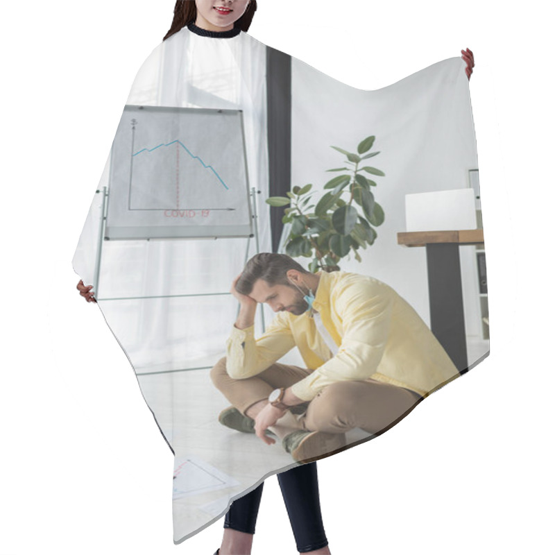 Personality  Depressed Businessman Touching Head While Sitting On Floor Near Documents And Flipchart With Covid-19 Inscription And Graphs Showing Recession  Hair Cutting Cape