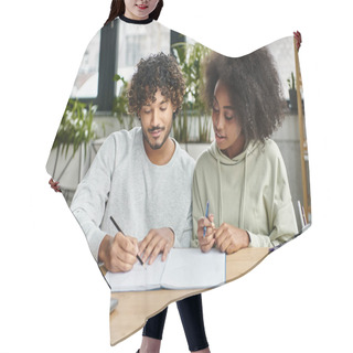 Personality  A Man And A Woman Of Different Ethnic Backgrounds Sit At A Table, Writing Together In A Modern Coworking Space. Hair Cutting Cape