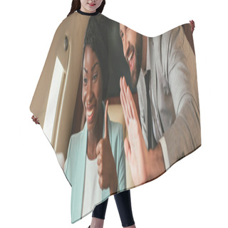 Personality  Panoramic Shot Of Cheerful Businessman Waving Hand And African American Businesswoman Showing Thumb Up During Video Call In Private Plane Hair Cutting Cape
