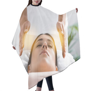 Personality  Cropped View Of Healer Standing Near Patient On Massage Table And Cleaning Aura Hair Cutting Cape