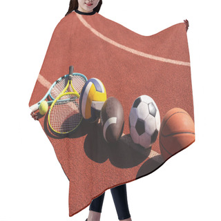 Personality  A Variety Of Sports Equipment Including An American Football, A Soccer Ball, A Tennis Racket, A Tennis Ball, And A Basketball. Hair Cutting Cape
