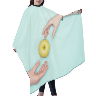 Personality  Cropped Shot Of Women Passing Green Apple Isolated On Turquoise Hair Cutting Cape