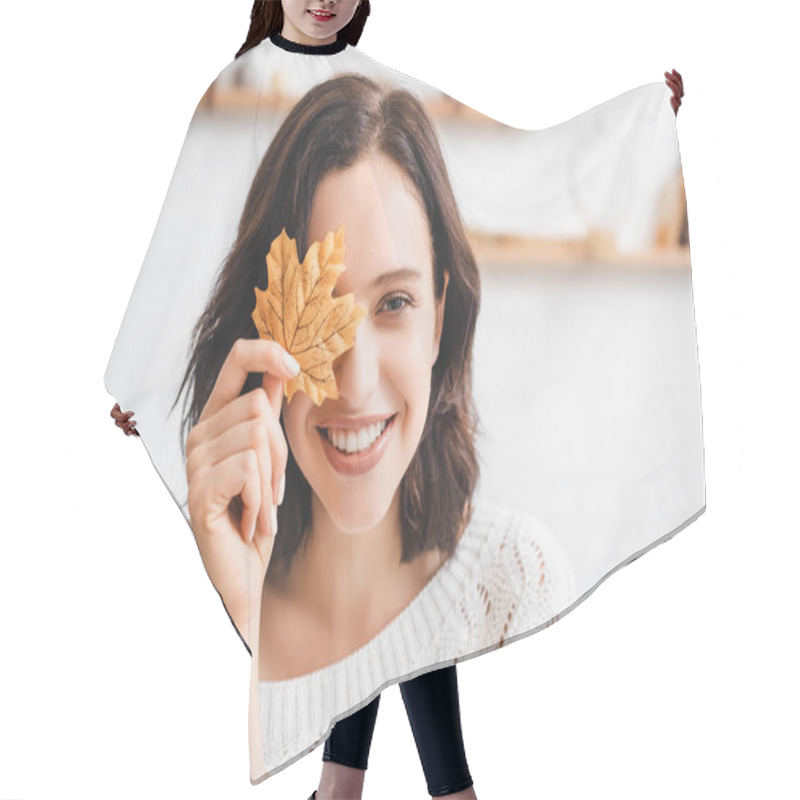 Personality  Beautiful Cheerful Girl Holding Yellow Autumn Leaf In Front Of Face  Hair Cutting Cape