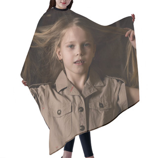 Personality  Funny Lovely Little Blonde Child With Different Emotions On A Dark Background. Beautiful Schoolgirl Holding Herself Hair Hair Cutting Cape