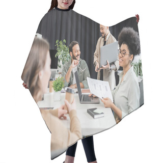 Personality  Happy African American Team Lead Holding Documents And Discussing Project With Female Colleague Hair Cutting Cape