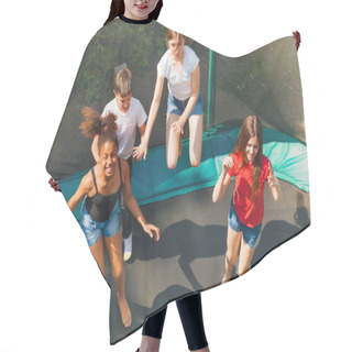 Personality  Top View Of Four Friends, Teenage Girls And Boys, Bouncing On The Outdoor Trampoline In Summer Hair Cutting Cape