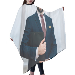 Personality  Cropped Shot Of Smiling Hotel Administrator With Clipboard Hair Cutting Cape