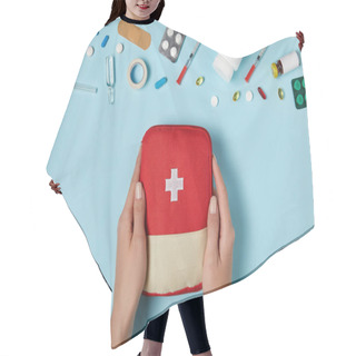 Personality  Cropped Shot Of Woman Holding First Aid Kit Bag Over Blue Surface With Various Medicines Hair Cutting Cape