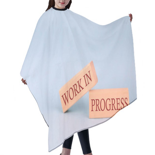 Personality  WORKS IN PROGRESS Text On Wooden Block, Blue Background Hair Cutting Cape