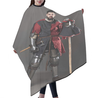 Personality  Medieval Knight On Grey Background. Portrait Of Brutal Dirty Face Warrior With Chain Mail Armour Red And Black Clothes And Battle Axe. Hair Cutting Cape