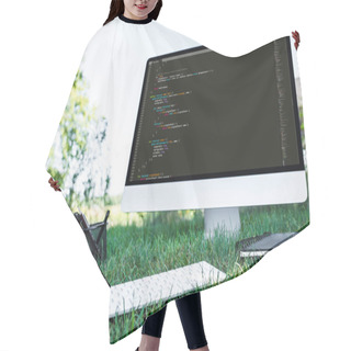 Personality  Selective Focus Of Computer With Programming Language Code On Grass Outdoors Hair Cutting Cape
