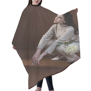 Personality  Adult Woman In Stylish Wear Looking Away, Sitting On Brown Background Hair Cutting Cape