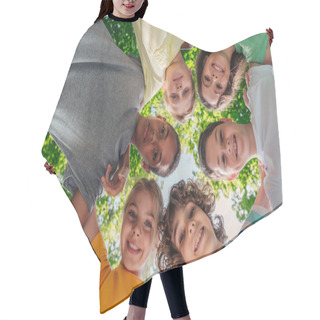 Personality  Bottom View Of Happy Multicultural Children Looking At Camera  Hair Cutting Cape