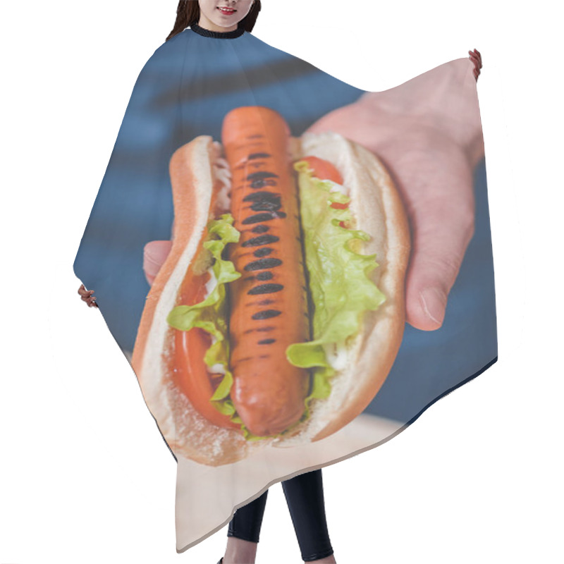 Personality  Man holding hot dog  hair cutting cape
