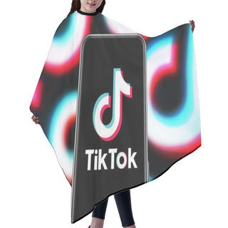 Personality  Smart Phone With TIK TOK Logo, Which Is A Popular Social Network On The Internet.United States, Canada, Wednesday, November 27, 2020 Hair Cutting Cape