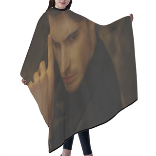 Personality  Focused Man Looking Distance In Dark Background. Rich Guy Touching Face Indoors. Hair Cutting Cape