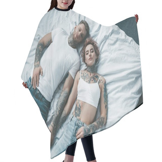 Personality  Top View Of Young Tattooed Couple Holding Hands And Lying On Bed Hair Cutting Cape