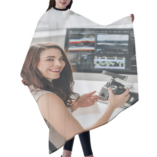 Personality  Happy Art Editor Holding Digital Camera Near Table With Computer Monitors  Hair Cutting Cape