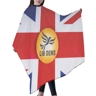 Personality  London, UK - November 20th 2018: A Liberal Democrats Political Party Badge, Pictured Over The Flag Of The United Kingdom. Hair Cutting Cape