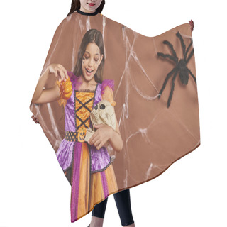 Personality  Smiling Girl In Halloween Costume Holding Pumpkins And Skull On Brown Backdrop, Spooky Season Hair Cutting Cape