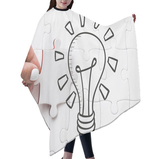 Personality  Cropped View Of Woman Holding White Jigsaw Near Connected Puzzle Pieces And Light Bulb  Hair Cutting Cape