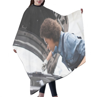 Personality  Young African American Mechanic Fixing Motor In Car With Open Hood In Garage Hair Cutting Cape