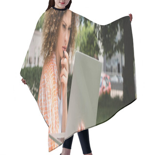 Personality  Pensive Freelancer With Curly Hair Holding Laptop While Sitting In Green Park, Banner  Hair Cutting Cape