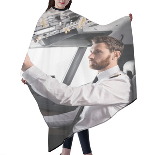 Personality  Bearded Pilot Reaching Overhead Panel While Using Yoke In Airplane Simulator Hair Cutting Cape