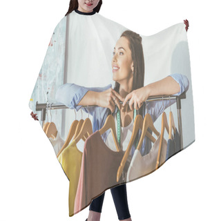 Personality  Smiling Seamstress Leaning On Rack With Hangers And Clothes Hair Cutting Cape