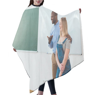Personality  Smiling African American Teacher Introducing New Girl In Classroom  Hair Cutting Cape