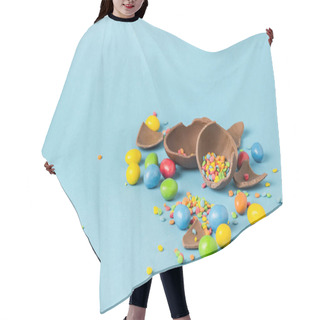 Personality  Broken Chocolate Easter Egg And Multicolored Sweets On A Blue Background. Easter Celebration Concept Hair Cutting Cape