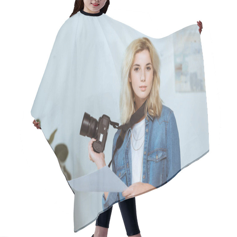 Personality  Portrait Of Young Photographer With Photo Camera And Photoshoot Example Looking At Camera In Studio Hair Cutting Cape