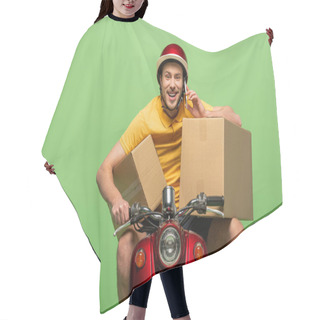 Personality  Happy Delivery Man In Yellow Uniform On Scooter With Boxes Talking On Smartphone Isolated On Green Hair Cutting Cape