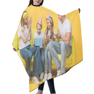 Personality  Cheerful Family In Birthday Party Caps, Son Holding Gift Box On Sofa On Yellow  Hair Cutting Cape