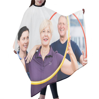 Personality  Senior Couple In Physiotherapy Doing Exercise With Hula Hoop Hair Cutting Cape