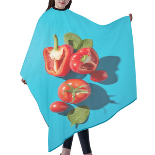 Personality  Set Of Fresh Vegetables Pepper, Tomato And Spinach Leaves On A Blue Background With Copy Space. Healthy Vegetables For Salad. Flat Lay Hair Cutting Cape