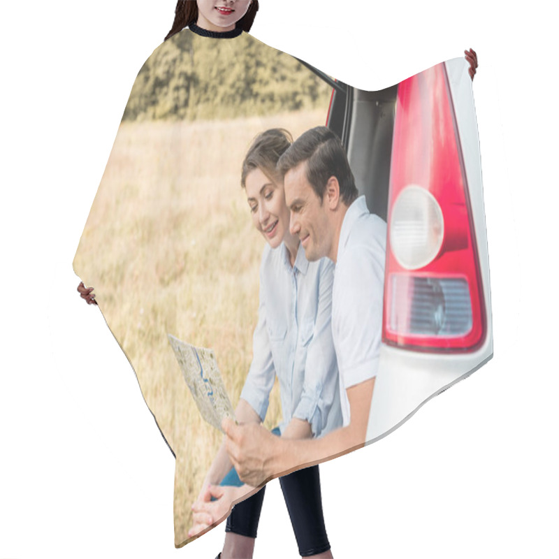 Personality  Happy Adult Couple Sitting In Car Trunk And Looking At Map Hair Cutting Cape