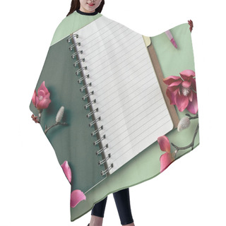 Personality  A Notebook Featuring Pink Flowers On A Green Background, Creating A Vibrant And Colorful Composition. Pink Magnolia Flowers. Hair Cutting Cape