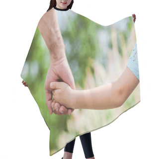 Personality  Cropped View Of Father Holding Hands With Daughter  Hair Cutting Cape