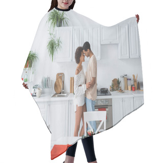 Personality  Side View Of Sexy African American Couple Embracing In Modern Kitchen With White Furniture Hair Cutting Cape