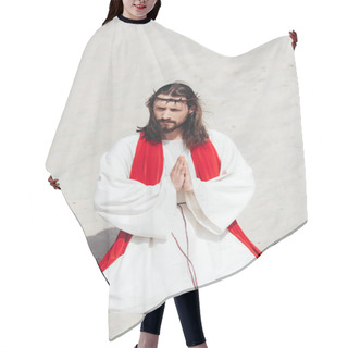 Personality  Jesus In Robe, Red Sash And Crown Of Thorns Standing On Knees And Praying In Desert, Looking Away Hair Cutting Cape