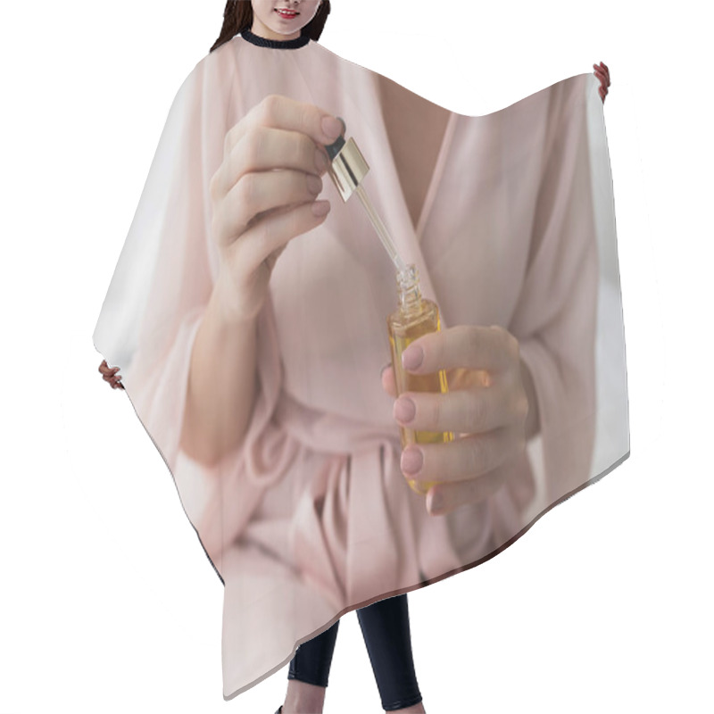 Personality  Hands Of Unrecognisable  Woman Holding Bottle With Cosmetic Serum. Hair Cutting Cape