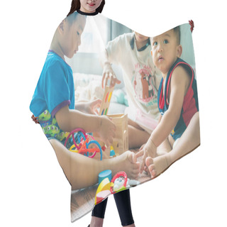 Personality  Asian Child Boy And Girl Enjoy Playing Wood Toy Together In Room Hair Cutting Cape