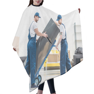 Personality  Two Movers Using Hand Truck While Transporting Refrigerator In Living Room Hair Cutting Cape