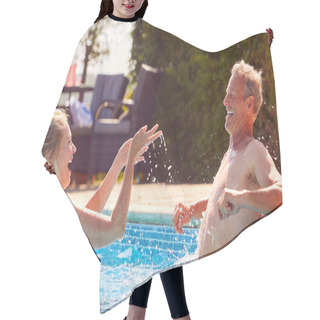 Personality  Retired Senior Couple Relaxing In Swimming Pool On Summer Vacation Splashing Each Other Hair Cutting Cape