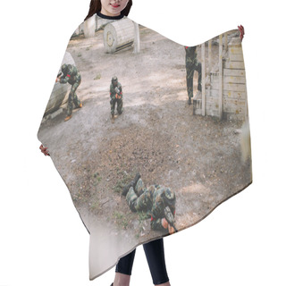 Personality  High Angle View Of Paintball Team In Uniform And Protective Masks Playing Paintball With Markers Guns Outdoors Hair Cutting Cape