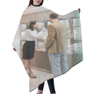 Personality  Seller Pointing At Accessories In Showcase Near Man In Jewelry Shop  Hair Cutting Cape