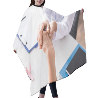 Personality  Selective Focus Of Doctor Holding Patient Hand Near Pink Ribbon On Table Hair Cutting Cape