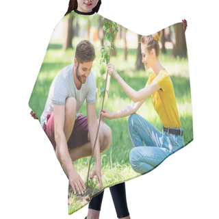 Personality  Young Couple Planting New Tree In Park  Hair Cutting Cape