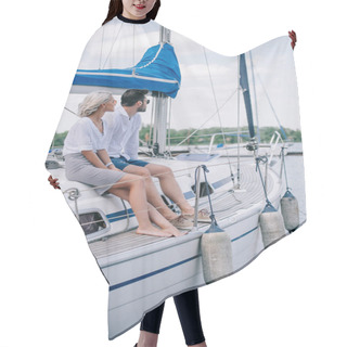 Personality  Beautiful Young Couple Sitting Together On Yacht And Looking Away Hair Cutting Cape